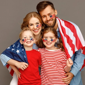 Family wearing American flag face tattoos for 4th of July Independence Day party