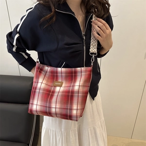 Stylish large red and white checkered crossbody tote bag with fashion tag and wide strap