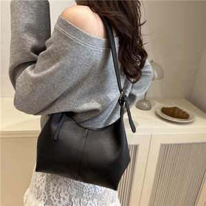 Minimalist black PU leather bucket bag for women with adjustable shoulder strap