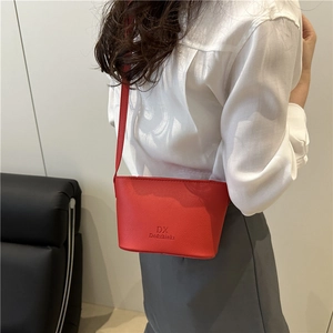 Red lychee pattern leather crossbody bucket bag with shoulder strap for women