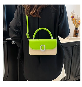 Detail of neon green and beige woven crossbody bag with metallic silver buckle closure