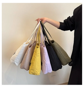 Collection of multi-color nylon tote bags with premium texture and logo patch detail