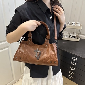 Chic brown faux leather crossbody bag with cross metal chain and stud details