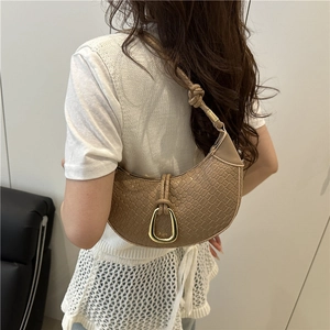 Brown woven half-moon tote bag with gold metal buckle and knotted shoulder strap
