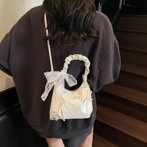 White satin crossbody box bag with lace bow and ruched handle for elegant summer styling