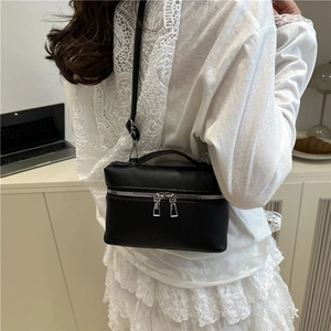 Fashionable black pebbled leather vanity crossbody bag for women with adjustable strap