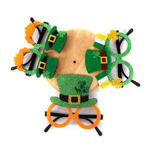 Set of four St. Patrick's Day party glasses with green clover and leprechaun hat designs