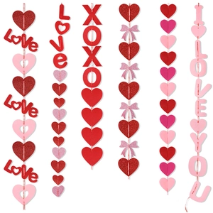 Close-up of Valentine's Day party hanging banners with glitter hearts and love letters
