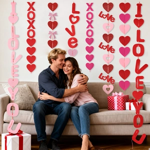 Romantic Valentine's Day party hanging decorations with red glitter hearts and I LOVE YOU banners