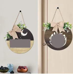 Detail of wooden Ramadan door signs with Arabic calligraphy, stars and moon patterns