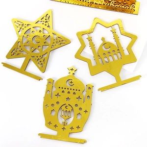 Three-piece gold acrylic Eid Mubarak table decor set with intricate hollow laser-cut patterns