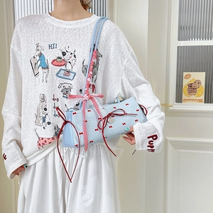 Light blue underarm bag with red bow prints and heart pendant in a trendy style