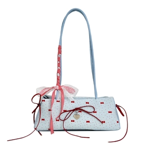 Light blue floral underarm bag with red bow prints and a silver heart pendant