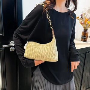 Beige straw woven hobo bag with golden chain strap for summer beach vacation style