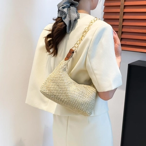 Beige straw woven hobo beach bag with chunky gold chain strap for summer vacation