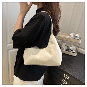 Detail of white half-moon underarm bag in textured leather with Fashion Bags logo