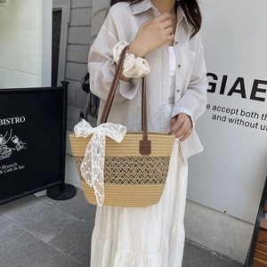 Straw woven tote bag with lace flower bow and brown leather shoulder straps for summer