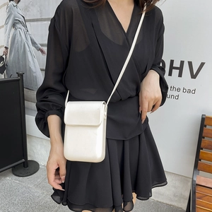 Minimalist white leather vertical crossbody phone bag with flap cover for women