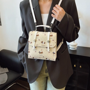 Chic beige square crossbody bag with cartoon dog prints and versatile double straps