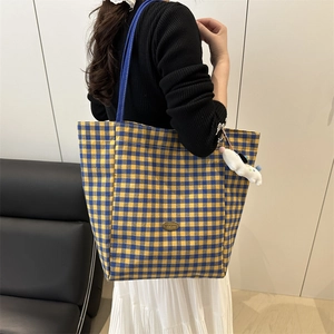 Women's yellow and blue checkered canvas tote bag with a cute white puppy pendant