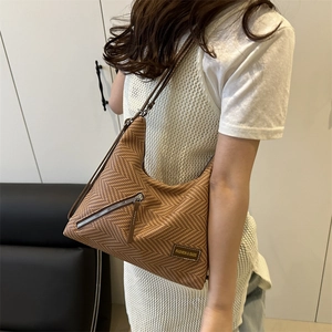 Brown woven hobo shoulder bag with V-pattern and zipper detail for stylish women