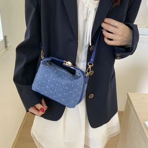 Blue denim crossbody bag with white polka dots and gold metal handles for summer 2025