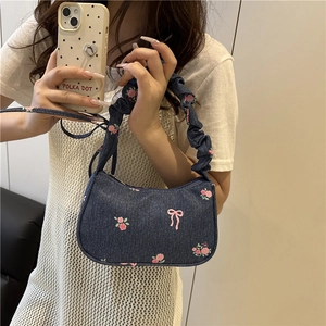 Floral embroidered dark blue denim shoulder bag with ruffled straps and rose patterns