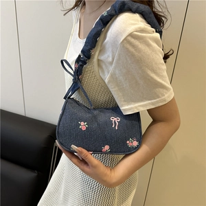 Navy denim shoulder bag with floral embroidery and ruched strap for women