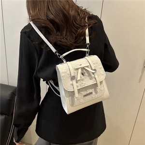 Chic beige mini backpack for women with embossed floral texture and bow detail