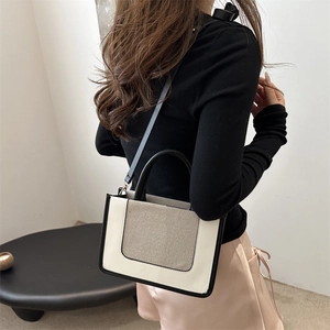 Minimalist two-tone leather crossbody tote bag for women in elegant white and taupe colors