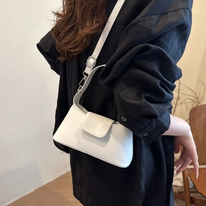 Chic white leather half-moon shoulder bag for women with adjustable strap and silver buckle