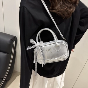 Silver metallic bowling handbag with lace bow charms and detachable shoulder strap