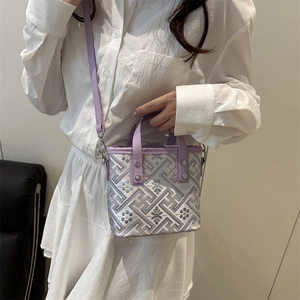 Chic silver floral woven crossbody bucket bag with purple straps and silver hardware