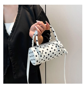 Polka dot cylinder bag with dual top handles and adjustable shoulder strap for women