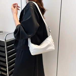 Minimalist white leather shoulder bag with adjustable strap and sleek matte finish for women