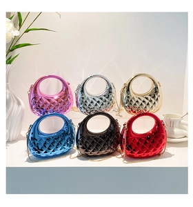 Quilted acrylic shell handbags in vibrant colors on a modern decorative display