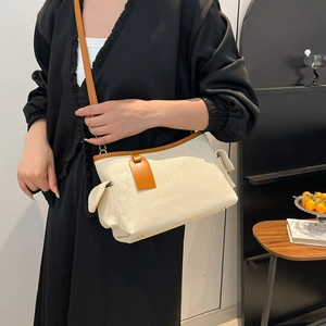 Minimalist beige canvas and brown leather shoulder bag with sleek Korean style design