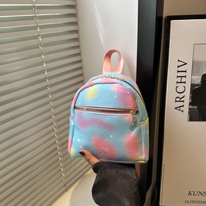 Macro shot of mini gradient PU backpack with lovely heart logo and gold zipper detail