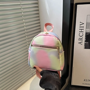 Close-up of mini backpack with macaron tie-dye gradient and pink top handle detail