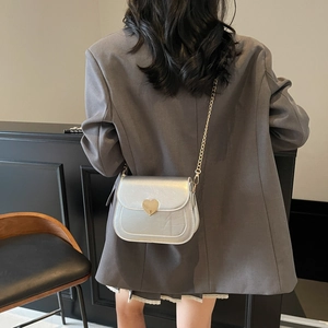 Chic silver crossbody square bag with golden heart buckle and fine chain strap