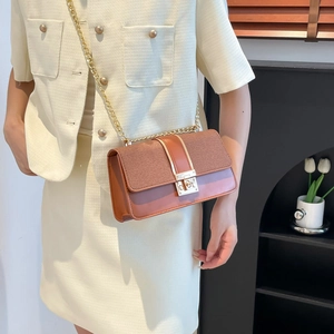 Minimalist brown patchwork square crossbody bag with gold chain and woven texture