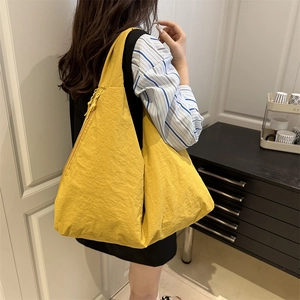 Large yellow nylon hobo bag for women with minimalist wrinkled texture for daily commute