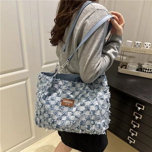 Chic blue denim checkerboard tote bag with distressed fringe and chain strap for women