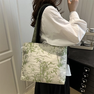 Women's large canvas tote bag with elegant green bamboo leaf print and green straps