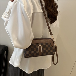 Vintage brown monogram crossbody bag for women with gold U-shaped buckle and leather trim