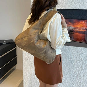 Retro brown oversized crescent bag with pleated PU leather detail and wide shoulder strap
