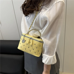 Chic yellow quilted square crossbody bag with silver studs and rose charm detail