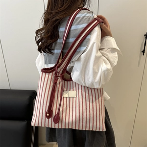 Stylish large red and white striped canvas tote bag with shoulder straps for women