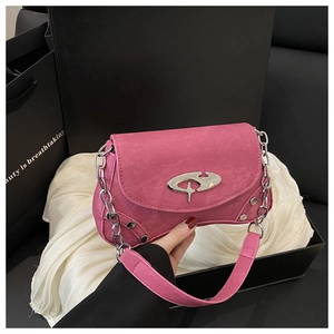 Detailed shot of pink star buckle handbag with silver studs and chain in gift box