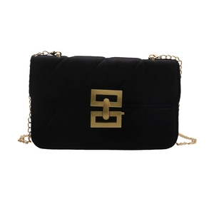 Elegant black velvet crossbody bag with gold chain and geometric clasp lock